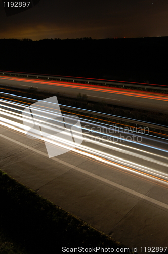 Image of highway at night with traffic