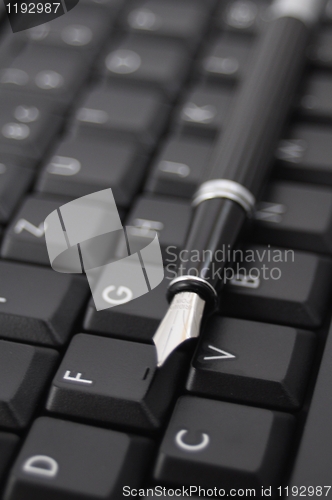 Image of pen and keyboard