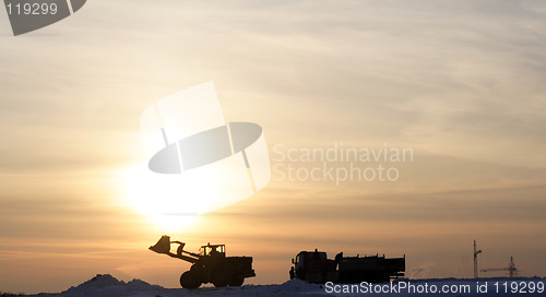 Image of loading work on background of sundown