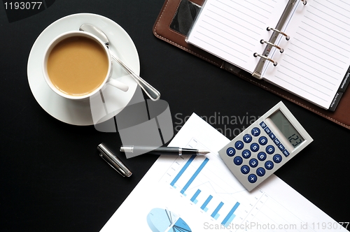 Image of coffee pen phone and paper