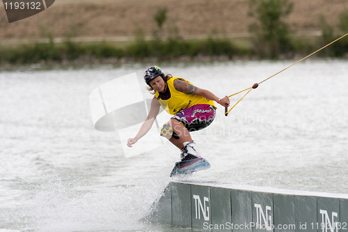 Image of Woman riding her wakeboard