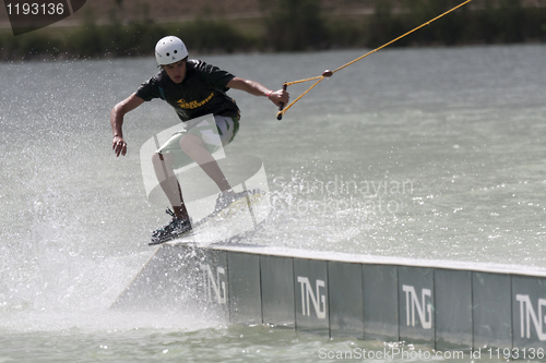 Image of Man rides his wakeboard