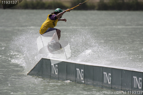 Image of Young rider jumping with his wakeboard