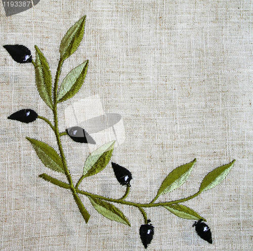 Image of Embroidery of olive branch on linen beige fabric 