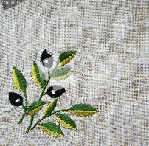 Image of Embroidery of olive branch on linen beige fabric 