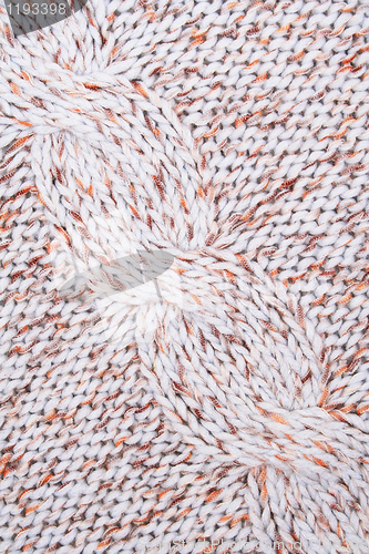 Image of White, brown and orange knitted textured as background 