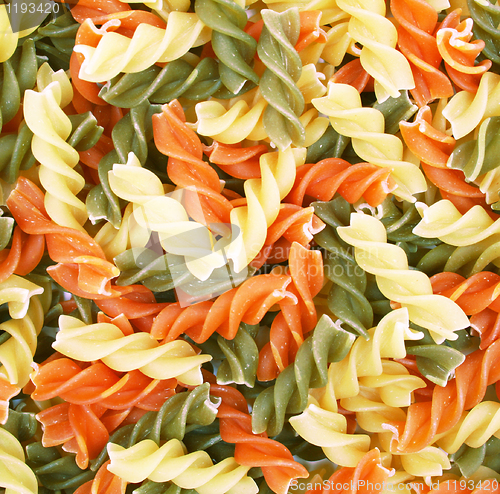 Image of Uncooked italian pasta - three colors spirals