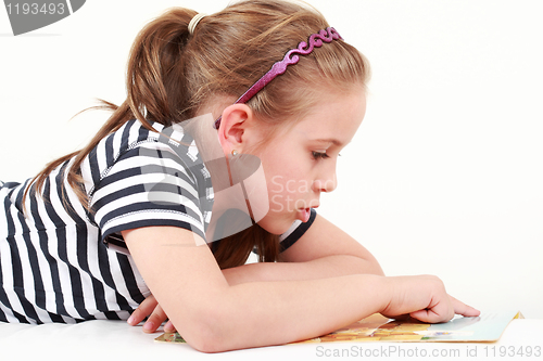 Image of Little girl reading