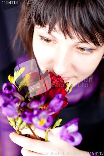 Image of woman with purple and red flowers