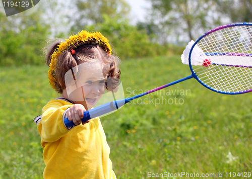 Image of little girl playing badminton