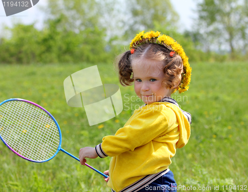 Image of little girl playing badminton