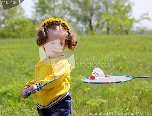 Image of little girl playing badminton