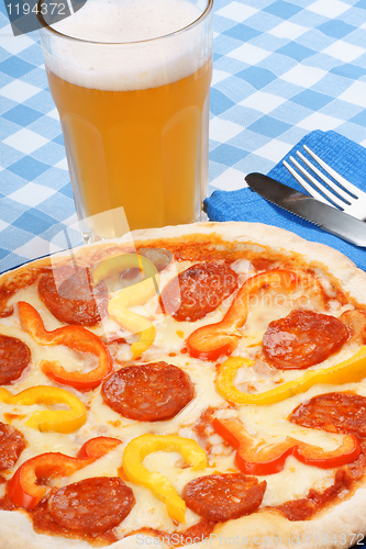 Image of Hot spicy pizza and beer