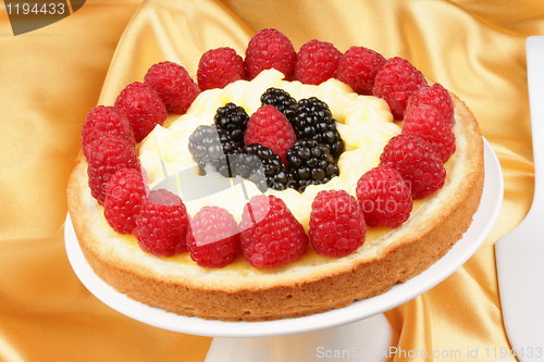 Image of Custard tart with raspberries and blackberries