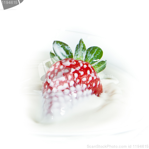 Image of strawberry splashing into milk