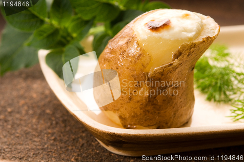 Image of Baked potato with sour cream and fresh dill