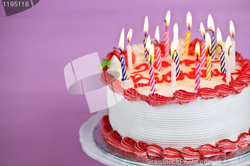 Image of Birthday cake with lit candles