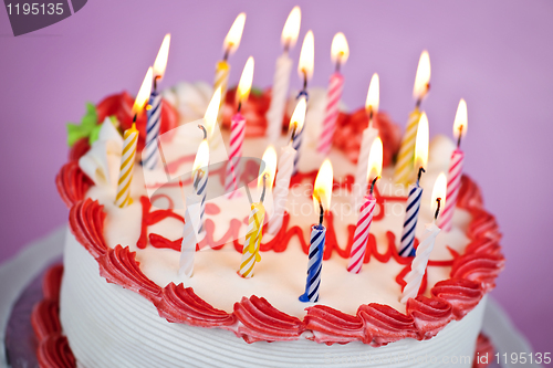 Image of Birthday cake with lit candles