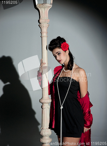Image of young woman and lightpole