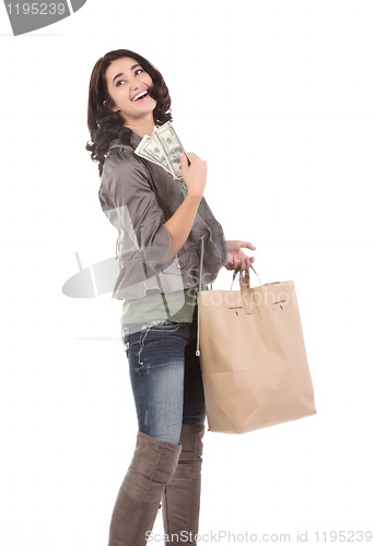 Image of young woman with shopping and cash