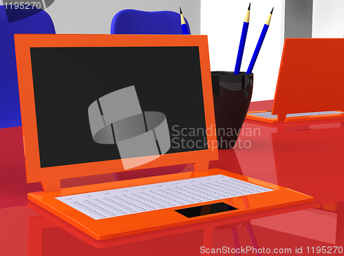 Image of stereoscopic laptops on red table with pencils