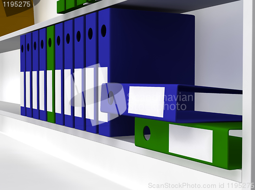 Image of Green and blue folders laying on shelf