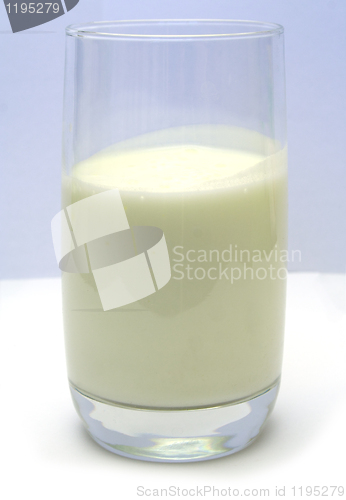 Image of Glass with kefir on smooth white table