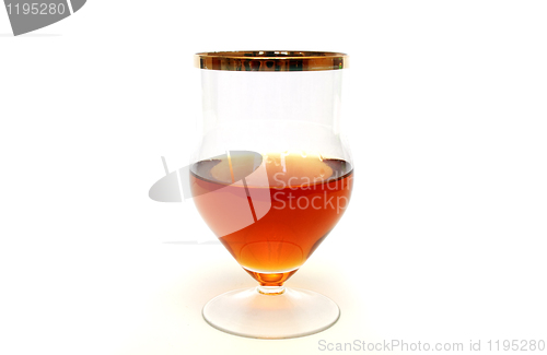 Image of Glass with cognac standing on white background