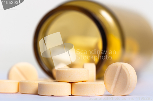 Image of Pills on isolated white background with bottle