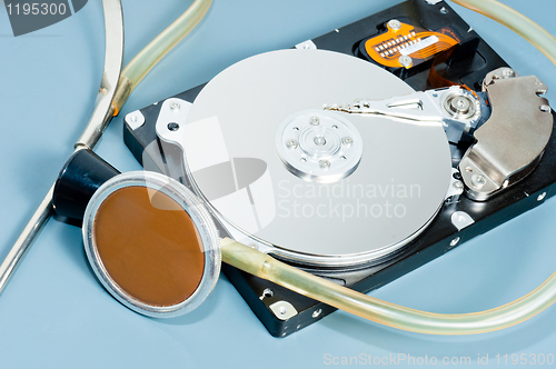 Image of stethoscope with hdd on blue background