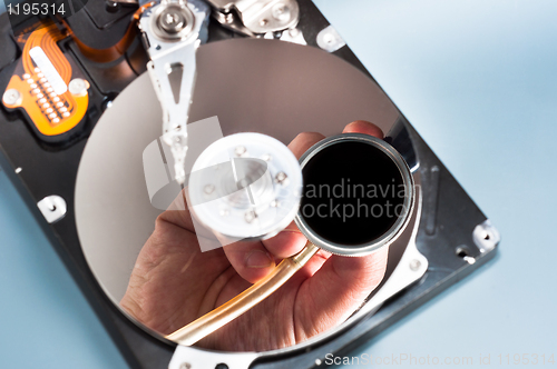 Image of Doctor inspecting bad hdd