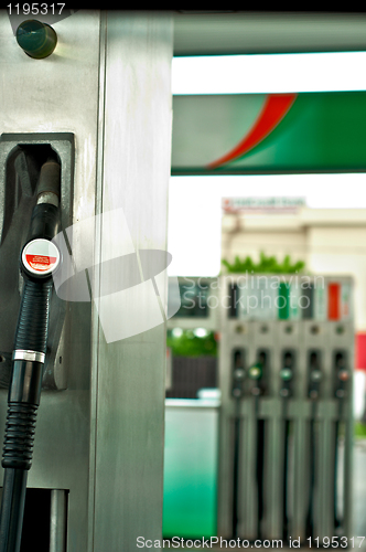 Image of Pump nozzles at the gas station