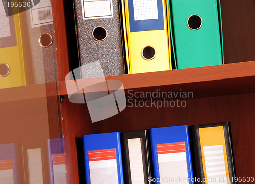 Image of Colorful files in office shelf