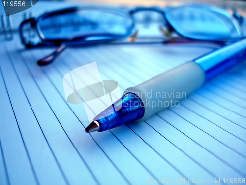 Image of pencil and glasses in blue