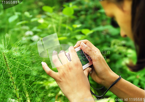 Image of Teenage girl with a camera