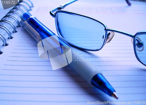 Image of pencil and glasses