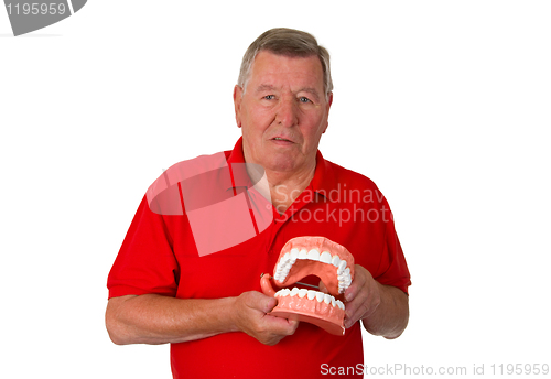 Image of Senior with teeth model
