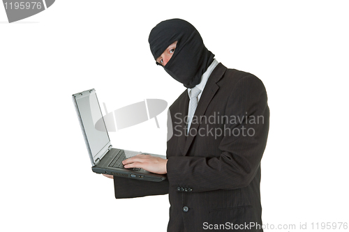 Image of Man stealing data from a laptop