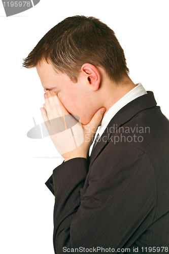 Image of Businessman hiding his face in shame