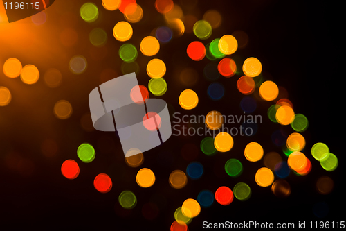 Image of Festive colorful lights over black