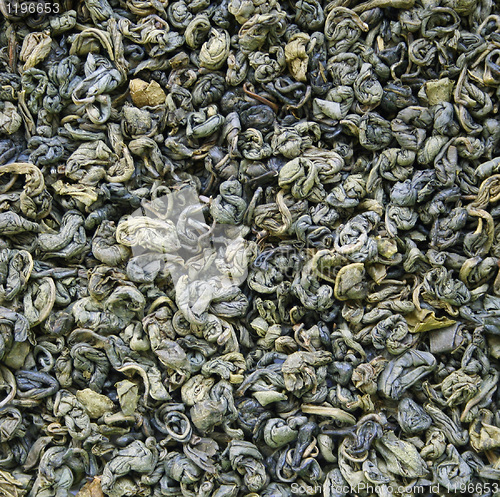 Image of Dry green tea leaves as background