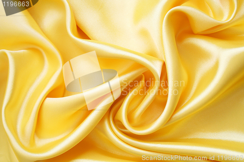 Image of Smooth elegant golden silk as background 