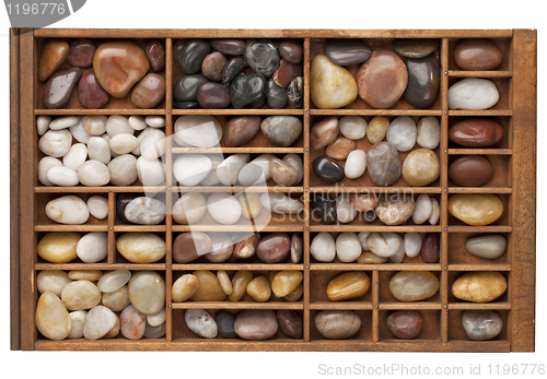 Image of river pebbles in typesetter drawer