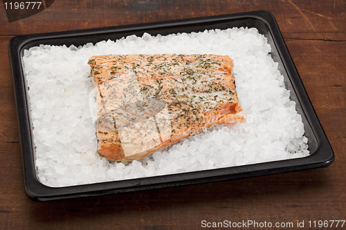 Image of salmon baked on rock salt