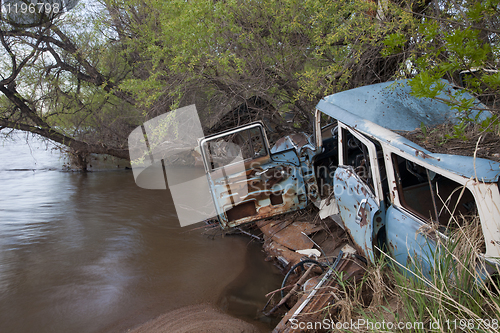 Image of junk cars on river