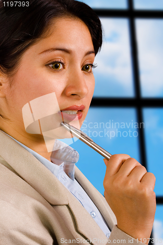 Image of Business Woman In Her Office Thinking