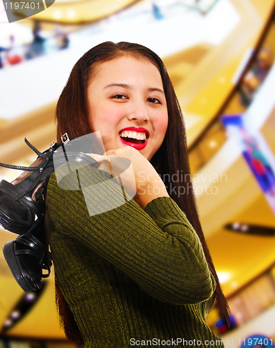 Image of Smiling Teenager in a Shopping Center