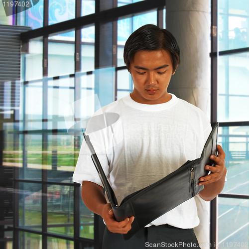 Image of Office Worker Standing By The Window