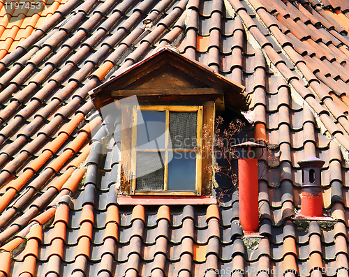 Image of old tiles roof and window