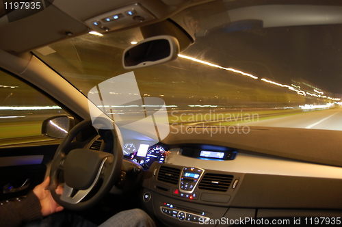 Image of car in motion at night